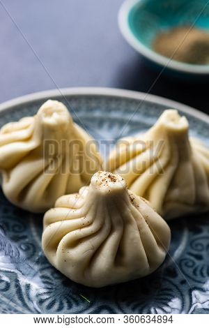 Traditional Georgian Khinkali Dish On Stone Background