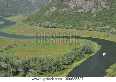 Rijeka Crnojevića, Part Of The Skadar Lake In Montenegro. Tourist Cruises By Boat On The Beautiful M