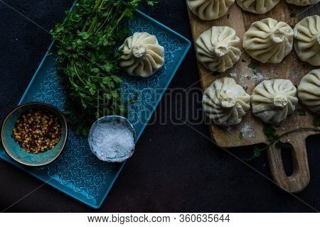 Traditional Georgian Khinkali Dish On Stone Background