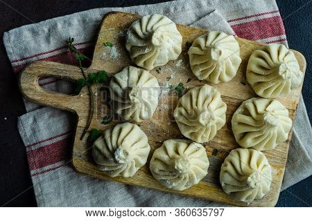 Traditional Georgian Khinkali Dish On Stone Background