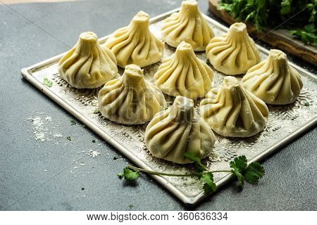 Traditional Georgian Khinkali Dish On Stone Background
