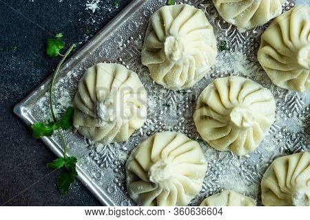 Traditional Georgian Khinkali Dish On Stone Background