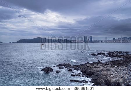 View Form Dongbaekseom Island On Cityscape Of Busan With Overcast Skies