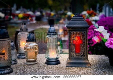 Lanterns And Candles On The Grave Devoted To All Souls Day