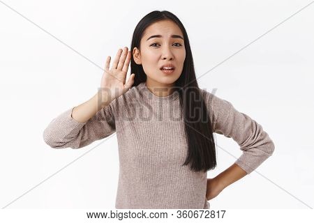 Speak Louder, Cant Hear You. Perplexed And Questioned Unsure East-asian Woman Didnt Catch What Was T