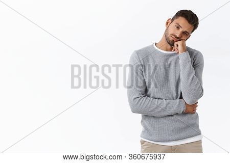 Bored, Uninterested Apathetic Handsome Bearded Guy, Tilt Head And Lean Face On Fist Look With Exhaus