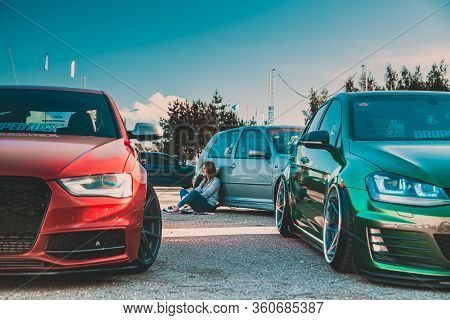 Moscow, Russia - July 6, 2019: Red Audi A4 And Green Volkswagen Golf. Sports And Tuned Cars Are Park