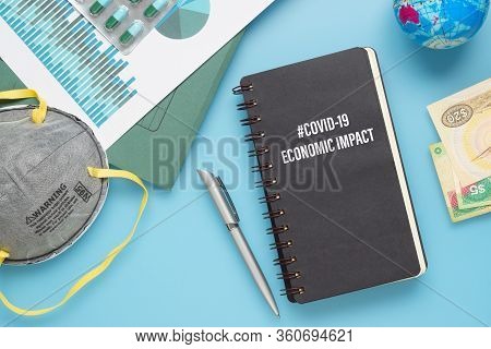 Covid-19 Or Corona Virus Economic Impact Background Concept. Mockup Notebook For Covid 19 Economic I