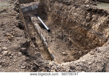 repair and replacement main pipeline of heating systems, district heating pipes network, water supply or Sewerage in city, removing old pipes and replacing them with new ones in a hole in the ground
