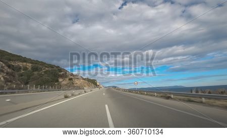Greek Empty Highway Without Traffic And Speed Limit Sign. Day Pov View Of Car Speeding On Multi Lane