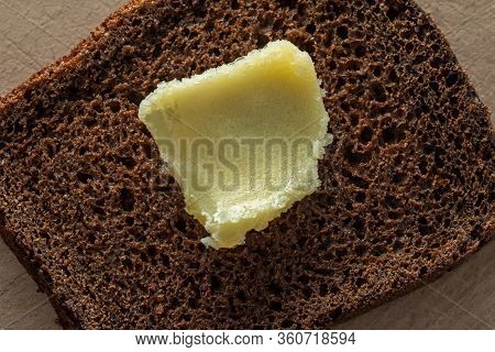 Ghee On A Piece Of Coarse Rye Bread. Healthy Foods.