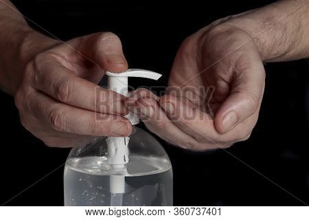 Horizontal View Hands In Foreground Using A Recommended Hygiene Gel To Prevent Any Posibility Of A C