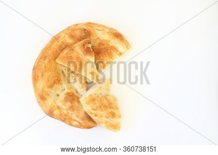 Slices Of Ramadan Pita (ramazan Pidesi) Traditional Turkish Bread For Holy Month Ramadan On White Ba