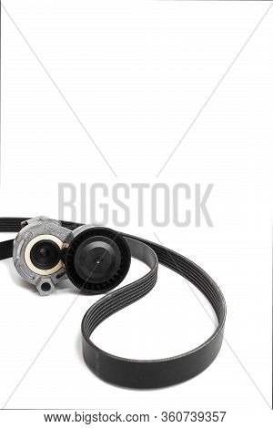 Roller And Timing Belt Isolated On White.