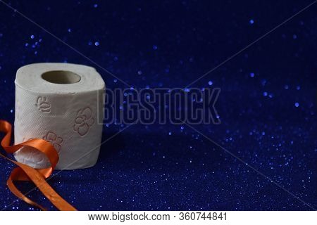 Roll Of Toilet Paper On Glitter Blue Background