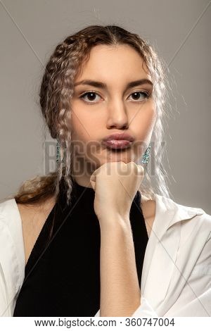 Fun Pretty Girl On Gray Background Looking At Camera Making Duckface