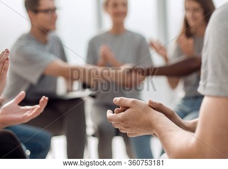 handshake of young people in a circle of like-minded people.