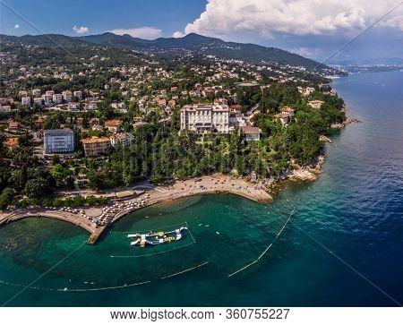 Beautiful panoramic view of Lovran village and its sea shore in Croatia. Top view photo taken on drone.