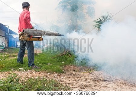Man Fogging To Prevent Spread Of Dengue Fever In Thailand