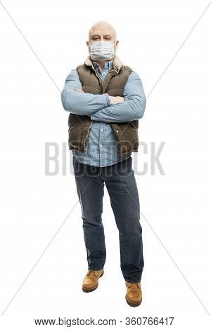 Bald Adult Man In A Medical Mask. Precautions Quarantined For The Period Of The Coronvirus Pandemic.