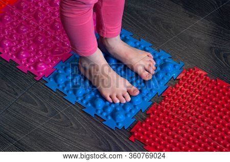 Barefoot Girl Walks On Sensory Mats In The Sensory Integration Room