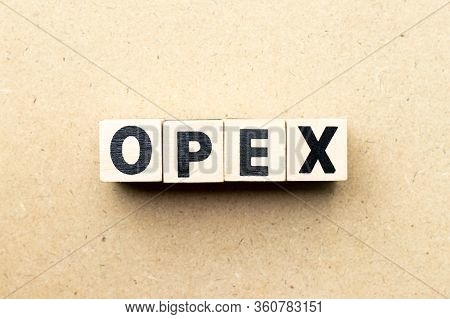 Letter Block In Word Opex (abbreviation Of Operating Expense) On Wood Background
