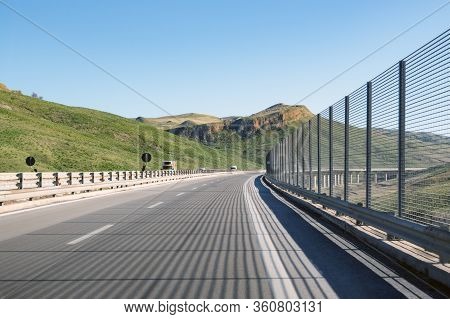 Sicilian Highway A19 Travelling Through This Beautiful Southern European Island. The Highway Is Equi