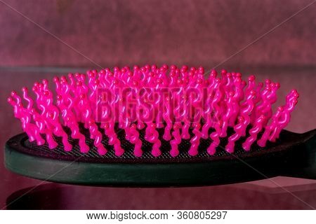 Detail Of A Funny Fuchsia Hair Brush With Crooked Bristles