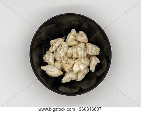 Closed Up Premium Jumbo Lump Of Fresh Blue Crab Meat In Small Black Ceramic Bowl Isolated On White B