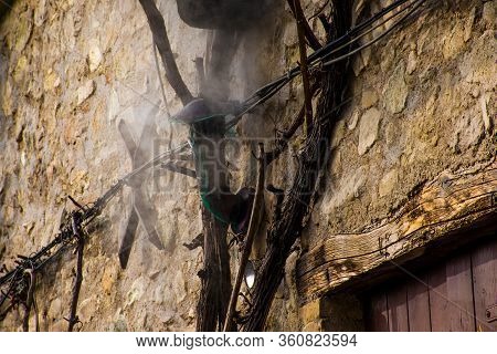 Smoke Comes Out Of The Chimney On The Stone Wall Of An Old Arqua Petrarca House In Padua