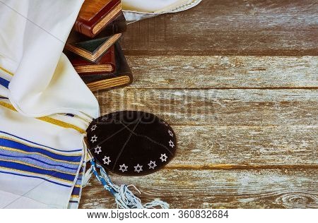 Jewish Ritual With Kippah And Talit Praying In The Jewish Hebrew Prayer Book On A Synagogue