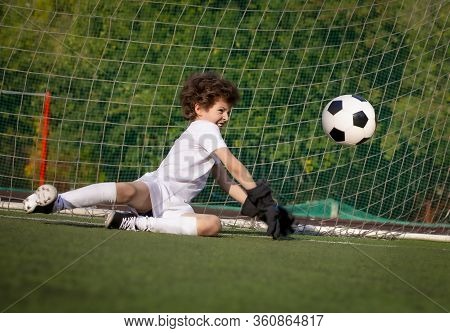 Summer Soccer Tournament For Young Kids. Football Club. Emotions And Joy Of The Game. Young Goalie. 