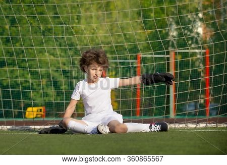 Summer Soccer Tournament For Young Kids. Football Club. Emotions And Joy Of The Game. Young Goalie. 