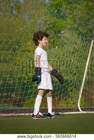 Summer Soccer Tournament For Young Kids. Football Club. Emotions And Joy Of The Game. Young Goalie. 