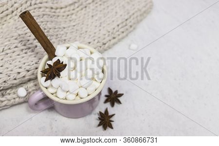 Marshmallows In Enameled Mug With Star Anise And Cinnamon Stick