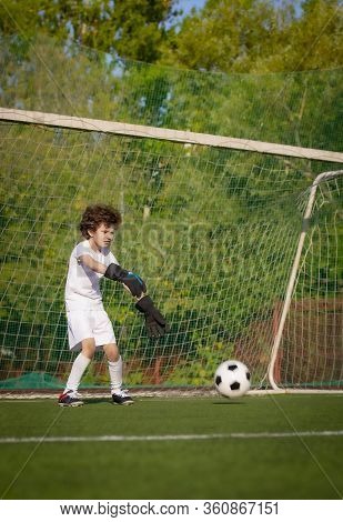 Summer Soccer Tournament For Young Kids. Football Club. Emotions And Joy Of The Game. Young Goalie. 