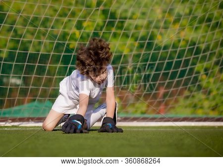 Summer Soccer Tournament For Young Kids. Football Club. Emotions And Joy Of The Game. Young Goalie. 
