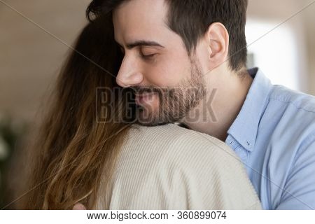 Young Bearded Man Embracing Wife After Reconcile.