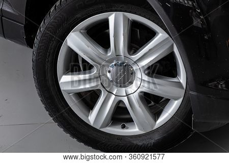 Novosibirsk/ Russia - April 02, 2020: Audi Q7, Car Wheel On Gray  Car - Close Up