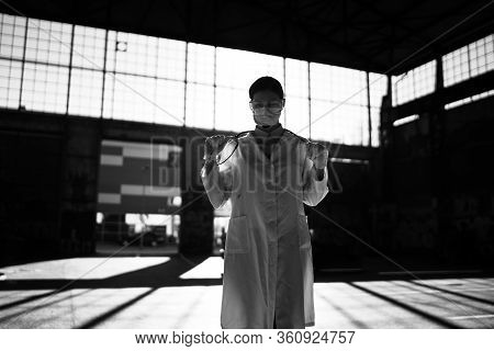 Depressed Sad Coronavirus Doctor Working In The Isolation Ward.medical Professional Treating Against