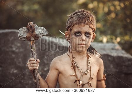 Angry Caveman, Manly Boy With Stone Axe. Prehistoric Tribal Boy Portrait Outdoors On Nature. Young S
