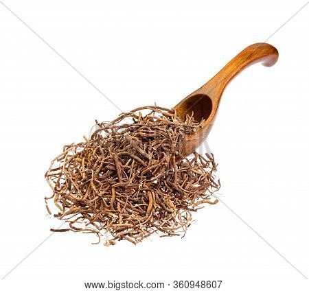 Valerian Root On The Wooden Spoon, Isolated.