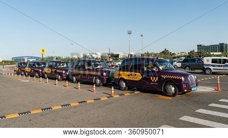Baku, Azerbaijan - July 2019: Baku Purple Taxis Waiting In Line At Heydar Aliyev Airport, Baku, Azer