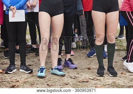 Young Female Atheletes Ready To Run. Race Start Line. Athleticism