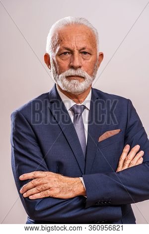 Portrait Of Serious And Authoritative Senior Businessman.