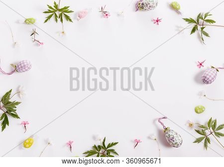 Easter Background With Easter Eggs And Spring Flowers. Top View With Copy Space