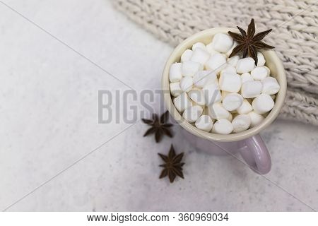 Marshmallows In Enameled Mug With Star Anise Top View