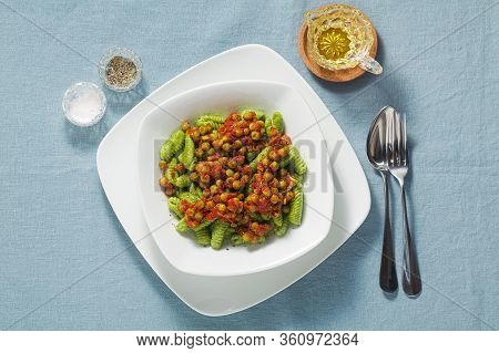 Italian Fresh Traditional Sardinian Pasta Gnocchi With Spinach And Green Pea Tomato Sauce. Spring Pa