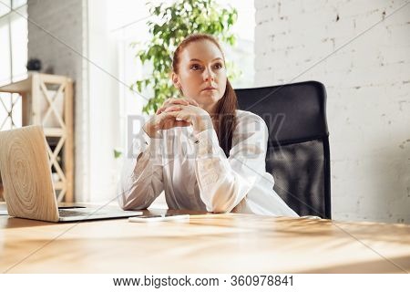 Looking At Side. Caucasian Young Woman In Business Attire Working In Office. Young Businesswoman, Ma