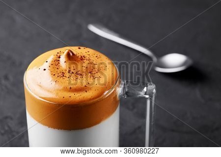 Dalgona Coffee In A Transparent Cup At Black Slate Table Top. Dalgona Frothy Coffee Is A South Korea